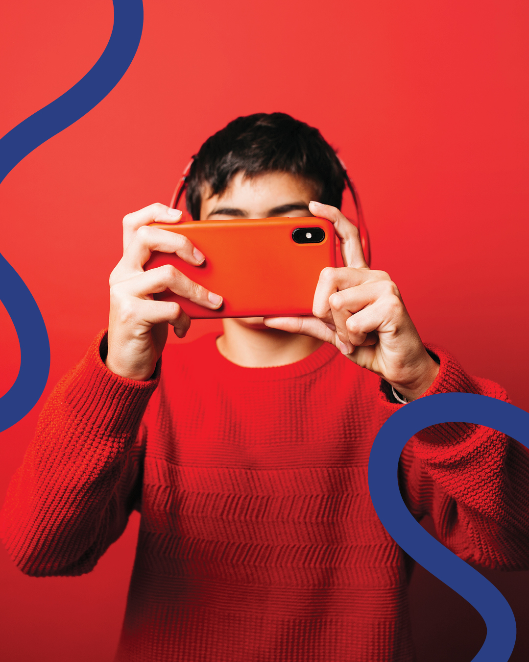 A young photographer holds a camera